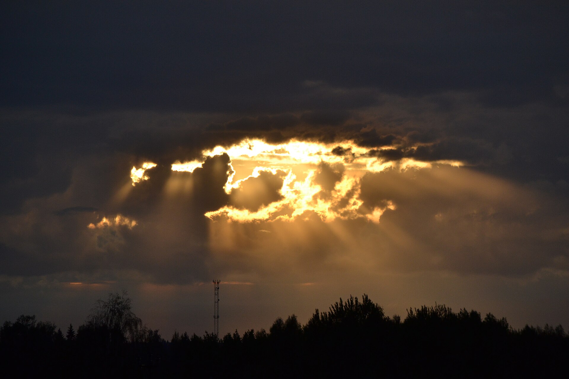 Light breaking through a dark sky