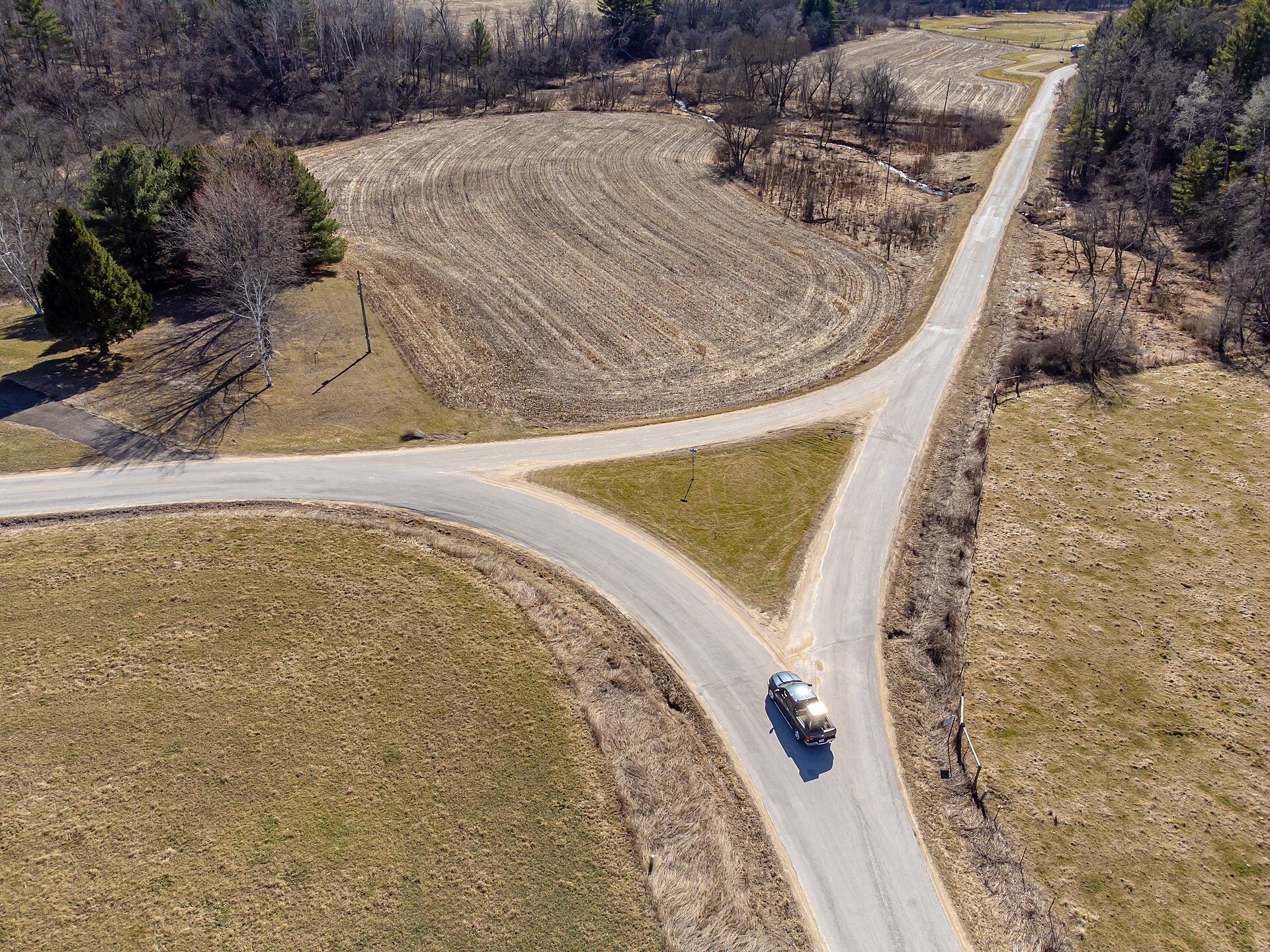A car approaching a fork in the road