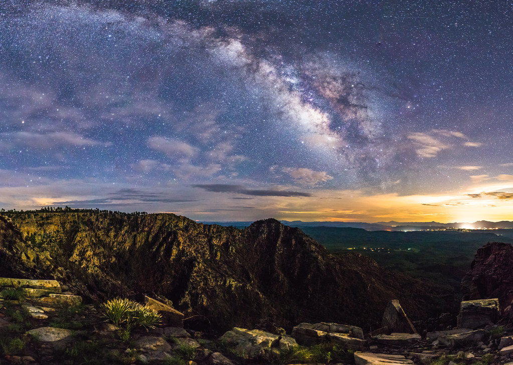 The Milky Way arching over a canyon