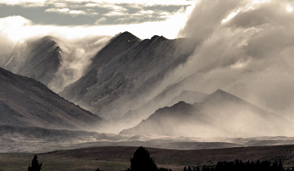 Mountain ridges fading into layers of cloud