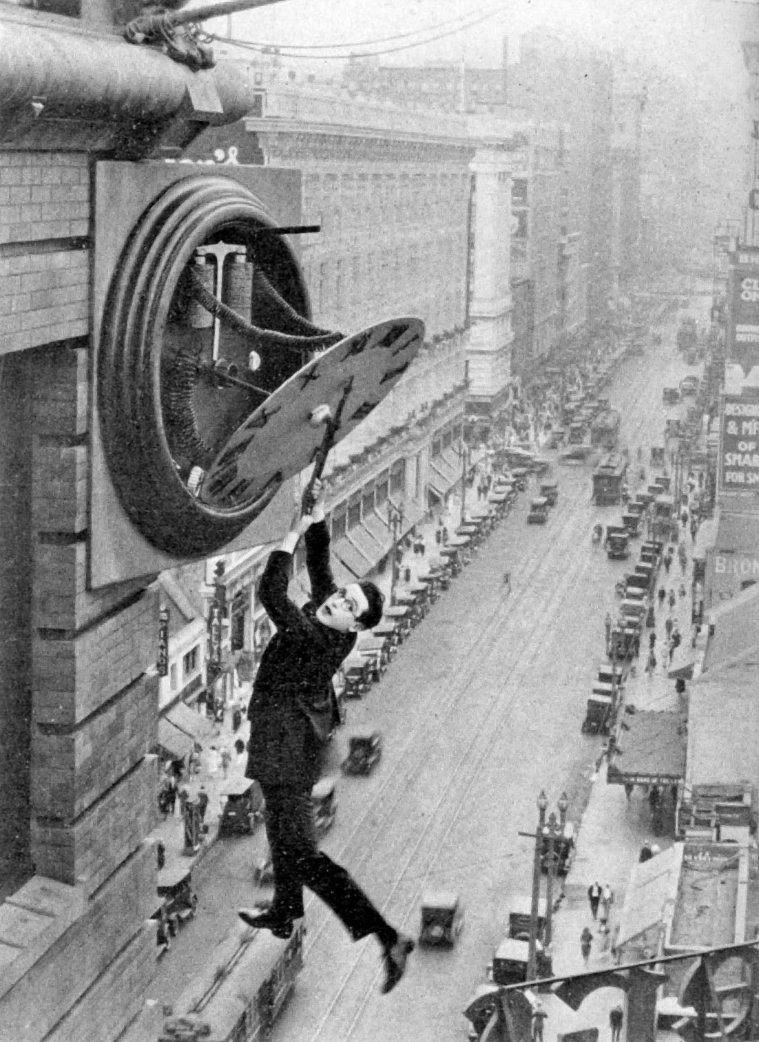 Harold Lloyd hanging from a clock in Safety Last! (1923)