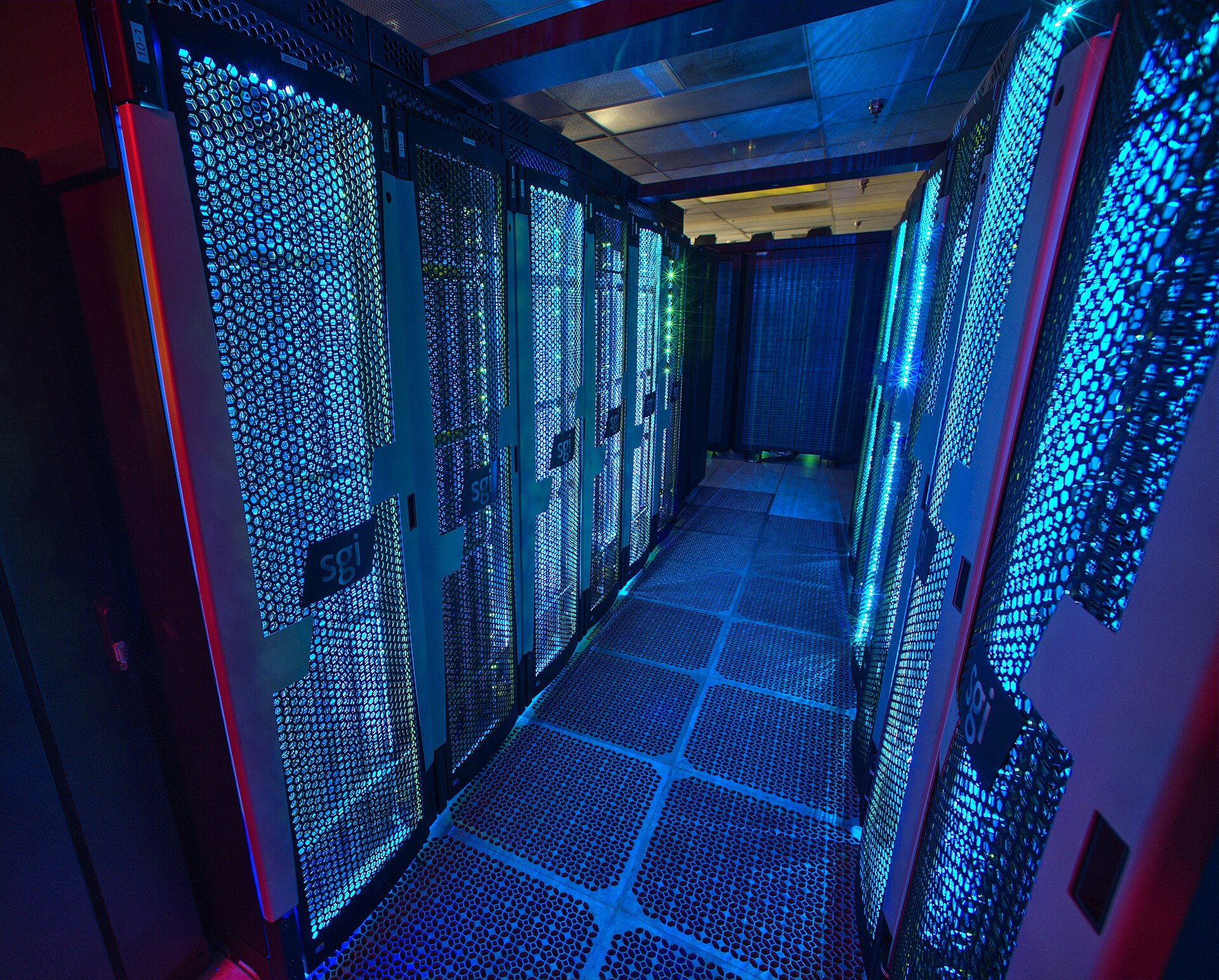 A supercomputer aisle glowing in the dark